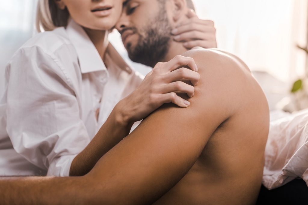 passionate woman scratching the back of a man